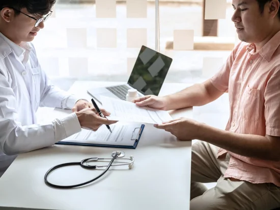 Doctor explaining to patient the necessary health screening preparations.