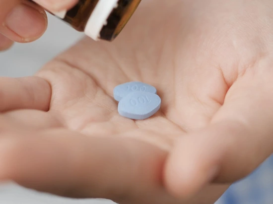 Man taking sildenafil pills for erectile dysfunction (ED) issue.