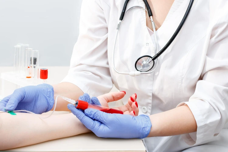 Doctor drawing blood from patient for blood test procedure.