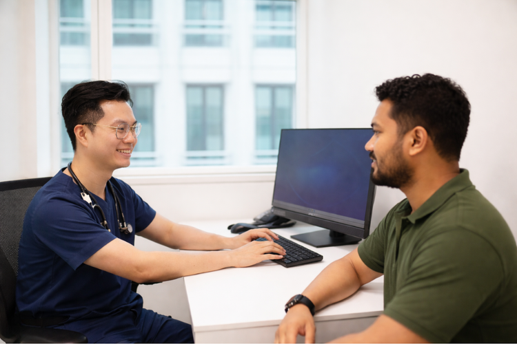 Doctor providing pre-travel consultation for a male patient preparing for Hajj.