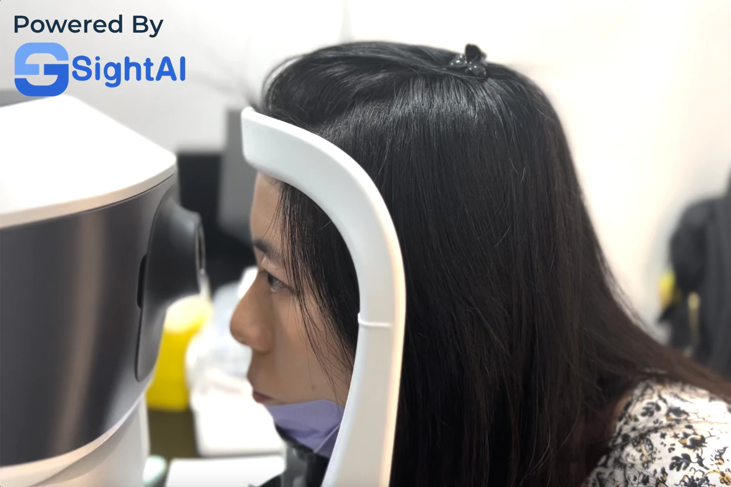 Lady undergoing eye screening at clinic.