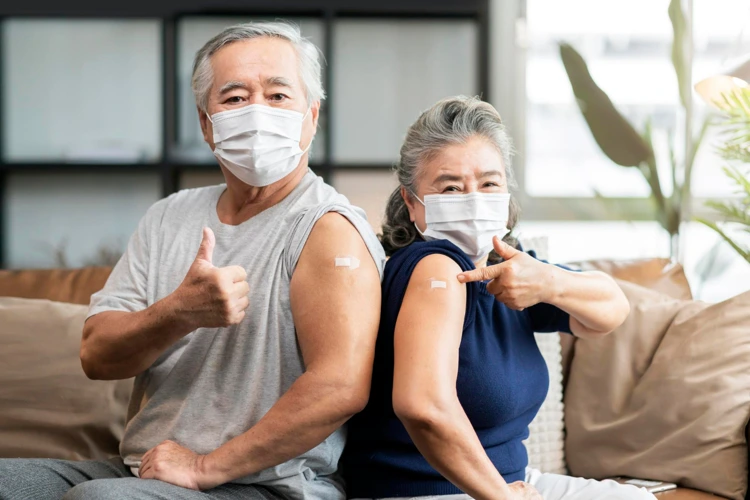 Elderly couple feeling strong and confident after getting the influenza vaccine jab.