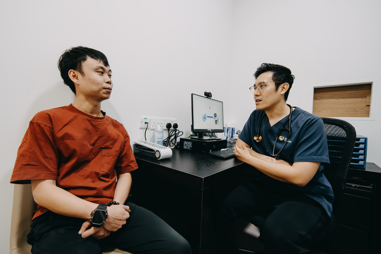 Occupational doctor Joel Foo consulting with a corporate employee at ATA Medical.