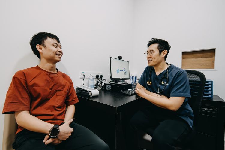 Male patient discussing erectile dysfunction with a male doctor at ATA Medical.