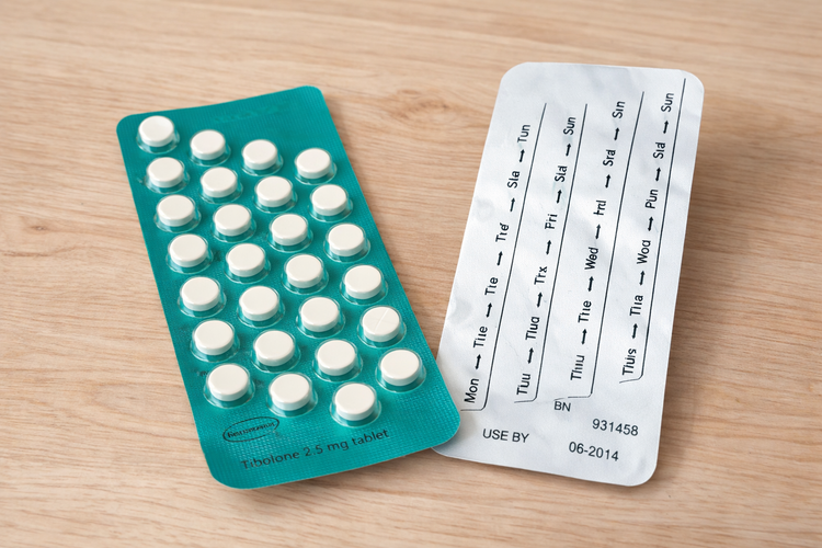 Blister pack of tibolone 2.5 mg tablets used for menopause symptom relief.