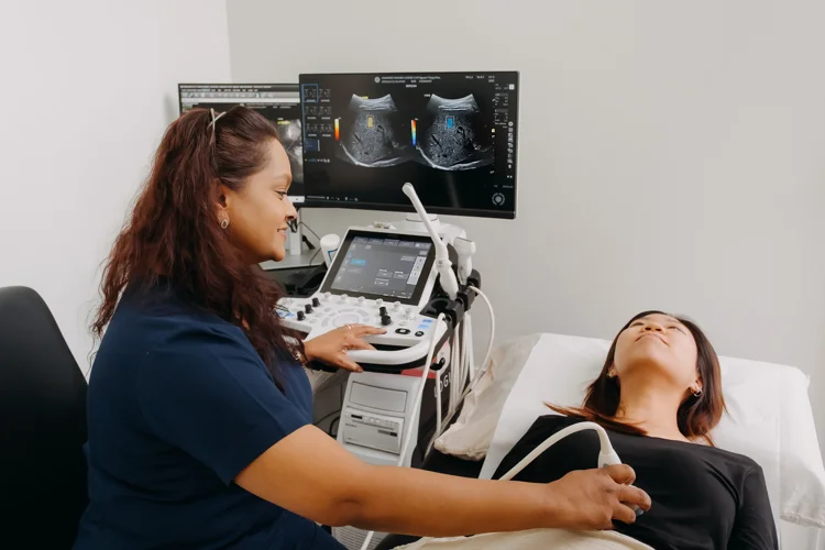 Female patient undergoing ultrasound scan procedure at ATA Medical Clinic.